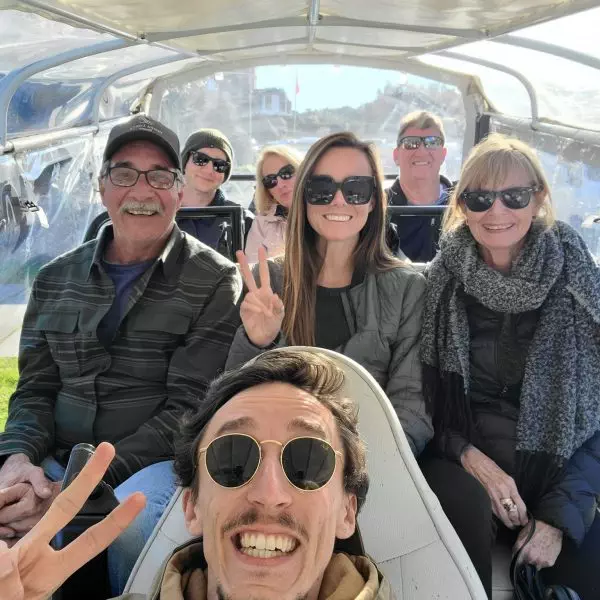 Happy group enjoying a private electric tuk tuk tour in Sintra with Daniel Ponce from Yes, You Deserve! — sunshine, smiles and unforgettable views in Portugal.